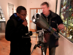 Mike demonstrates a telescope in the telescope workshop