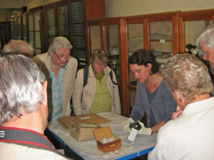 Dr Rebekah Higgitt shows the group items from the reserve collection